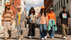 Diverse individuals in unique print-on-demand clothing representing sustainable fashion and self-expression