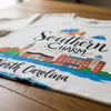 Close-up of Southern Charm t-shirt showcasing artistic design elements inspired by North Carolina culture