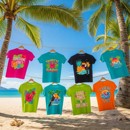 Colorful custom t-shirts with tropical designs displayed on a beach in Cairns, showcasing positive messages and artistic illustrations