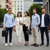 Diverse group in minimalist streetwear outfits against a modern city backdrop