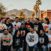 Diverse group wearing custom graphic apparel in Phoenix, showcasing unique designs and vibrant colors