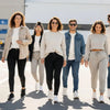 Diverse individuals in affirmation streetwear showcasing a stylish capsule wardrobe