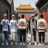 Diverse individuals in Hutong-inspired fashion apparel against a backdrop of traditional Beijing architecture