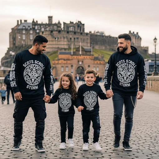Family wearing Scots Scroll Storm apparel in front of Edinburgh Castle, showcasing Scottish culture and artistic clothing
