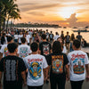 Young people in Manila wearing graphic tees inspired by local poetry and culture against a backdrop of Manila Bay