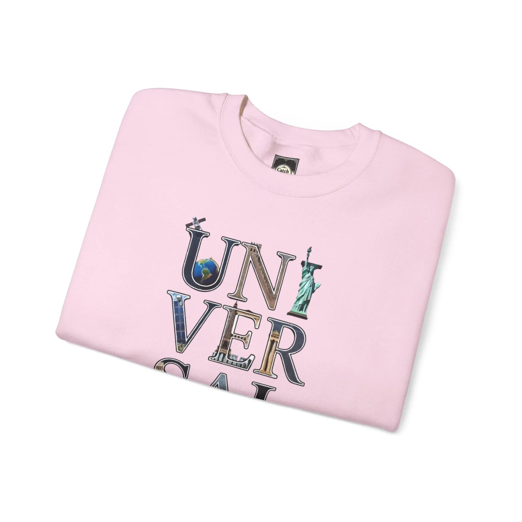 Folded pink sweatshirt with 'UNIVERSAL' text and iconic landmarks graphic print on front