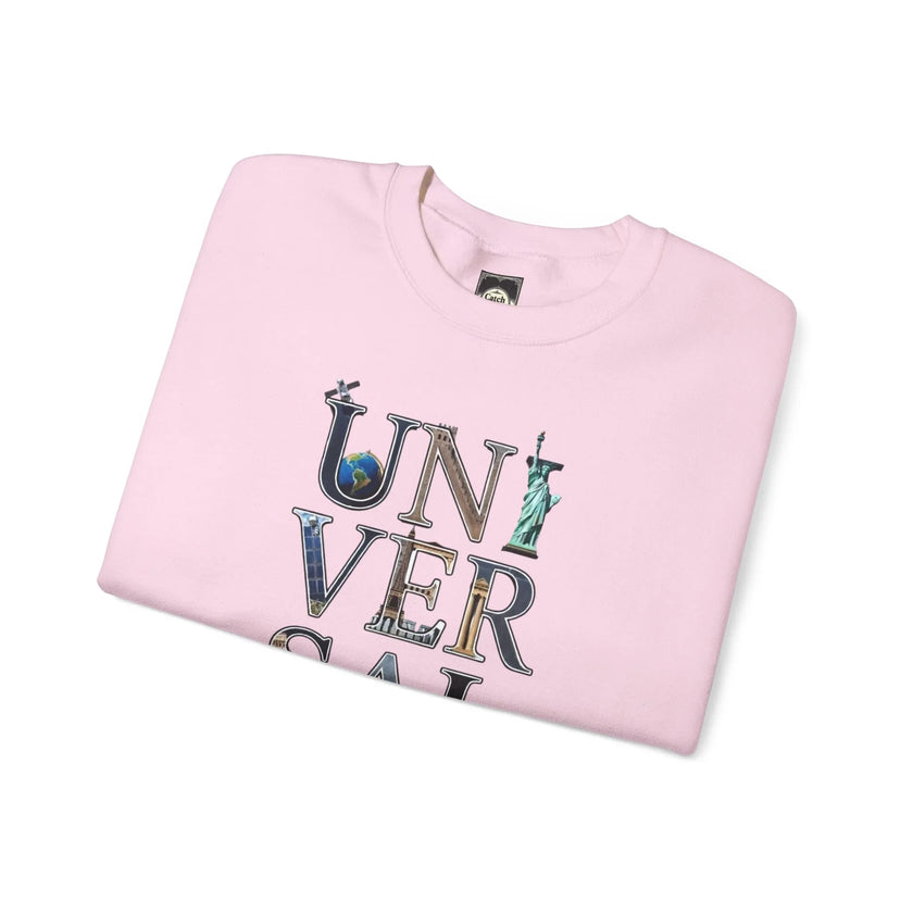 Folded pink sweatshirt with 'UNIVERSAL' text and iconic landmarks graphic print on front