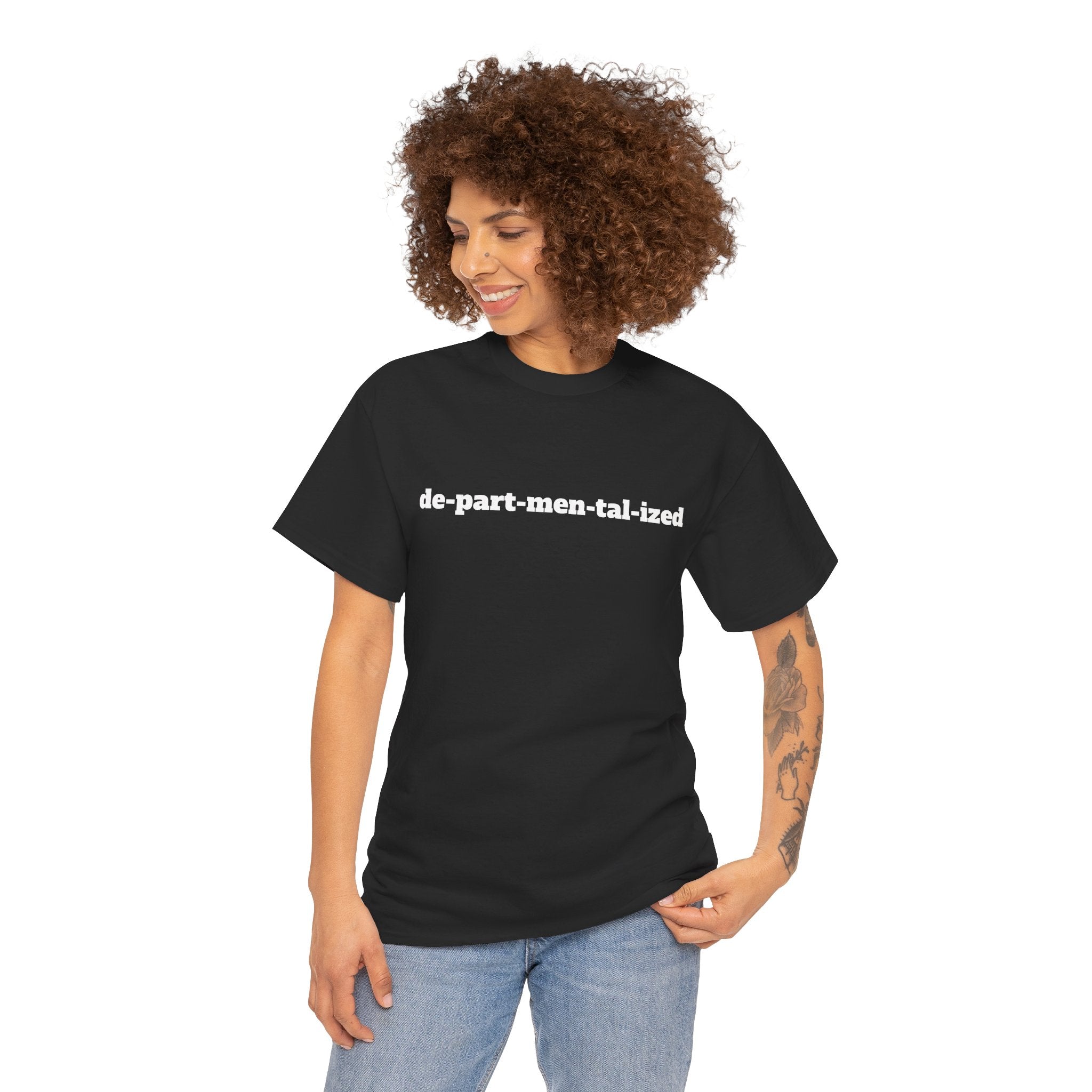 Woman wearing a black graphic t-shirt with 'de-part-men-tal-ized' text, casual fashion.