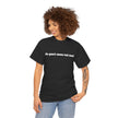 Woman wearing a black graphic t-shirt with 'de-part-men-tal-ized' text, casual fashion.