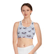 Woman wearing a white sports bra with 3D star pattern, athletic apparel, studio background