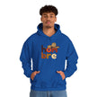 Man wearing blue hoodie with colorful 'hombre' text and sombrero graphic