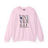 Light pink sweatshirt with 'UNIVERSAL' graphic, world landmarks in letters, laid flat.