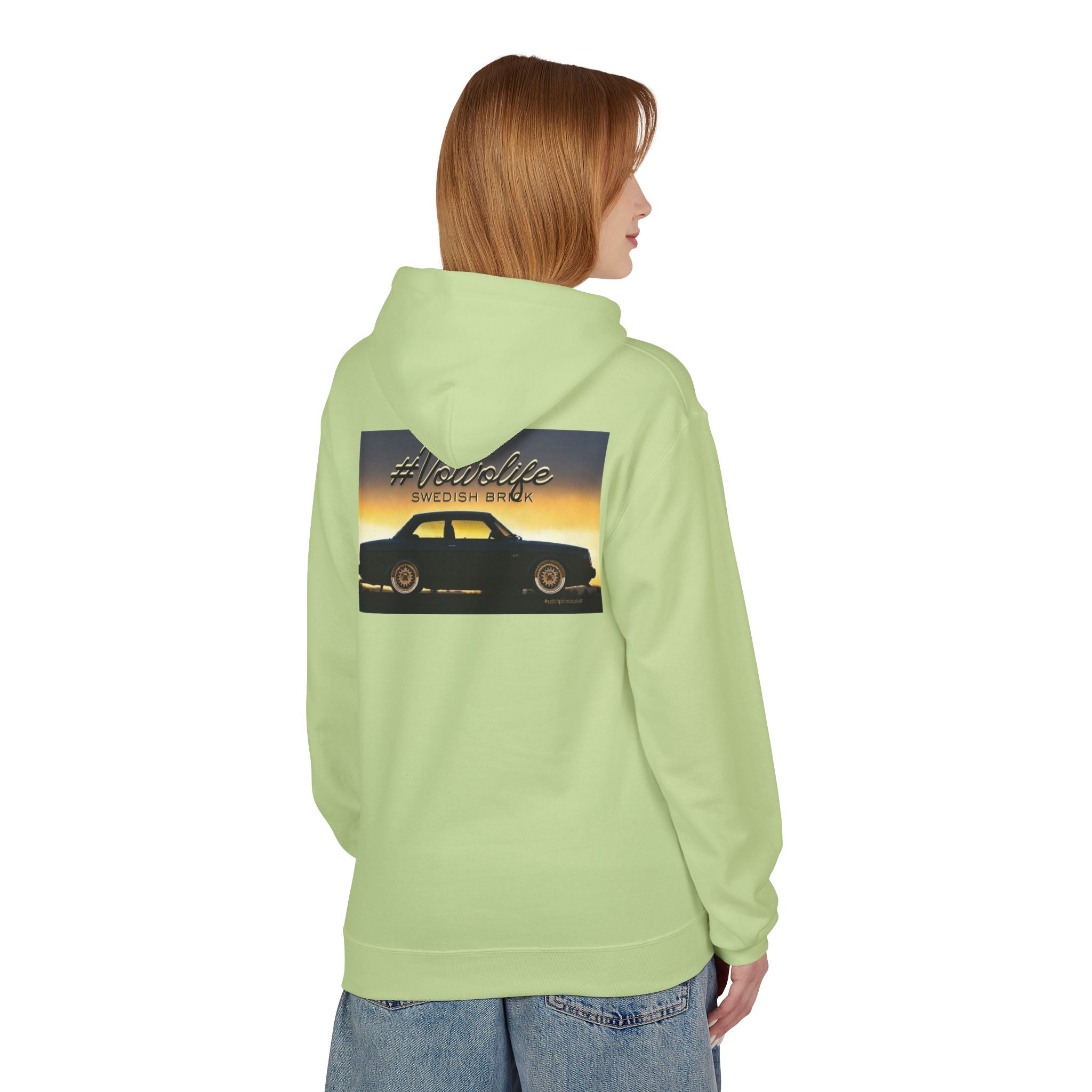 Person wearing light green hoodie with Volvo car and #Volvolife graphic on back