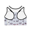 White racerback sports bra with black trim and 3D white star pattern on the back