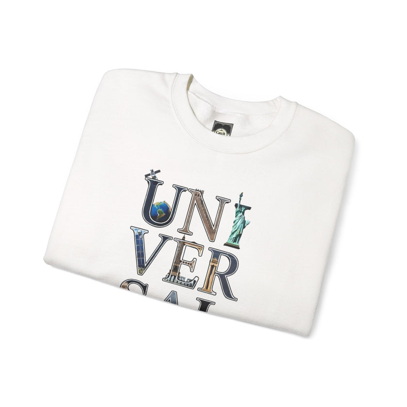 Folded white graphic sweatshirt with 'UNIVERSAL' text featuring travel-themed icons