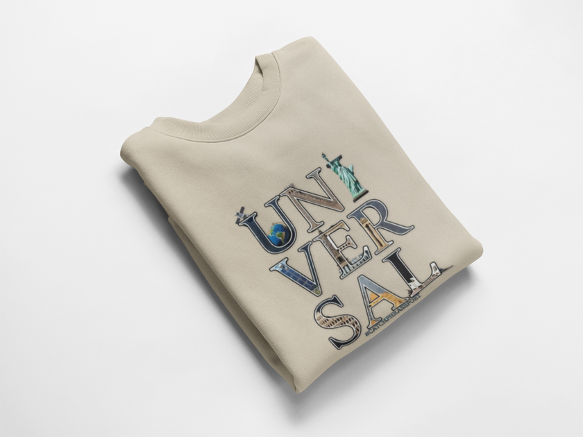 Beige folded sweatshirt with UNIVERSAL text and iconic landmark graphics on front