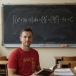 Solvable Graphic T-Shirt — Gold Text Puzzle Design