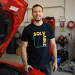 Solvable Graphic T-Shirt — Gold Text Puzzle Design