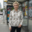 Cherub pattern all-over print zip hoodie, angel graphic streetwear, front view — Catch Phrase Poet