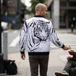 Tiger graphic bomber jacket with black rib-knit collar, cuffs and metal zipper detail — Catch Phrase Poet