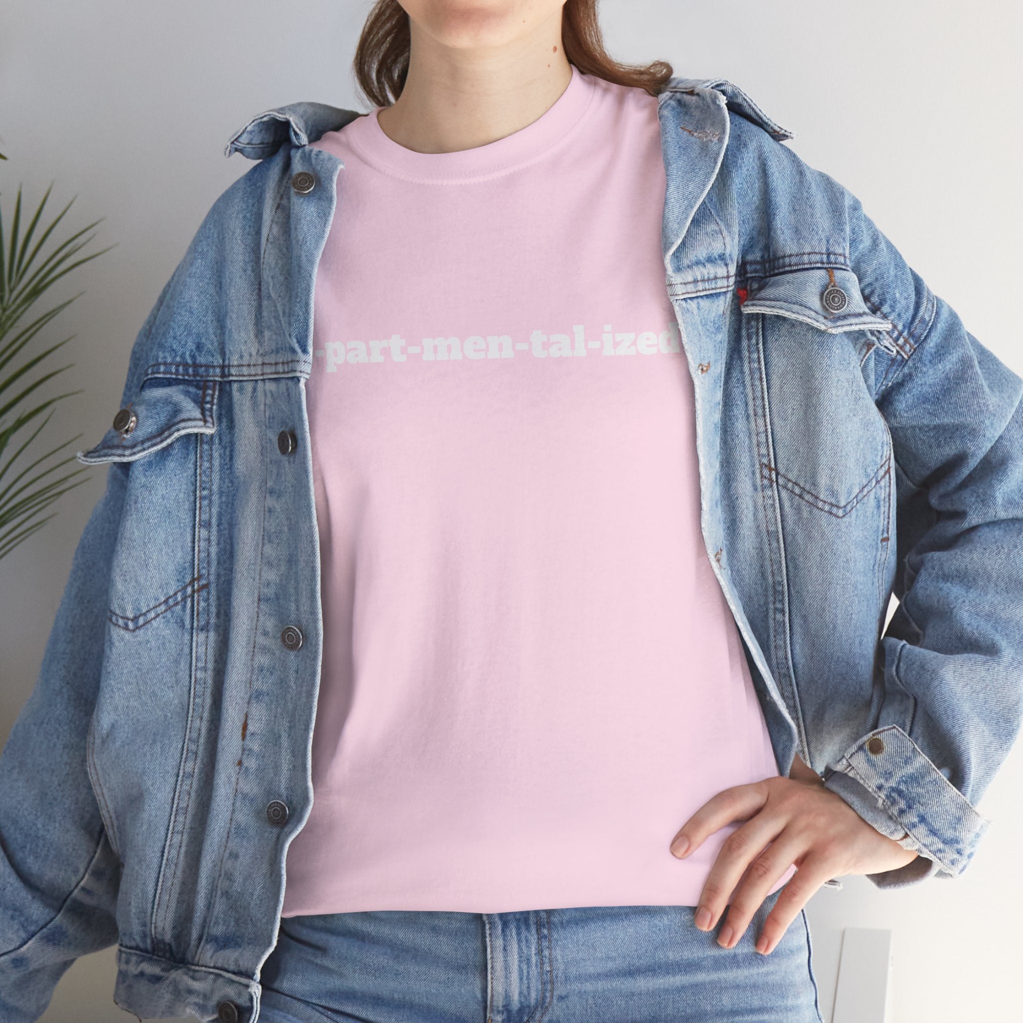 Woman in denim jacket wearing pink T-shirt with 'part-men-tal-ized' text