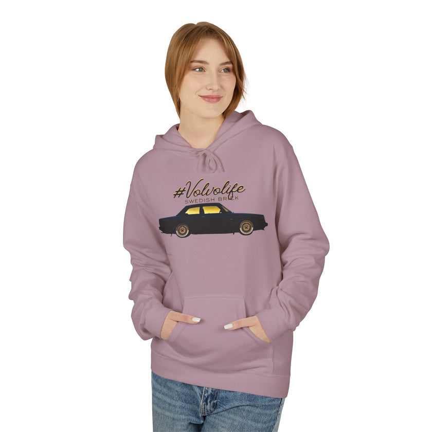 Woman wearing a mauve hoodie with #Volvolife Swedish Brick car graphic, casual fashion style
