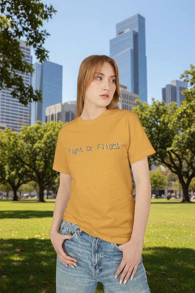 Woman wearing a mustard yellow t-shirt with 'Silence is Loud' text on a white background