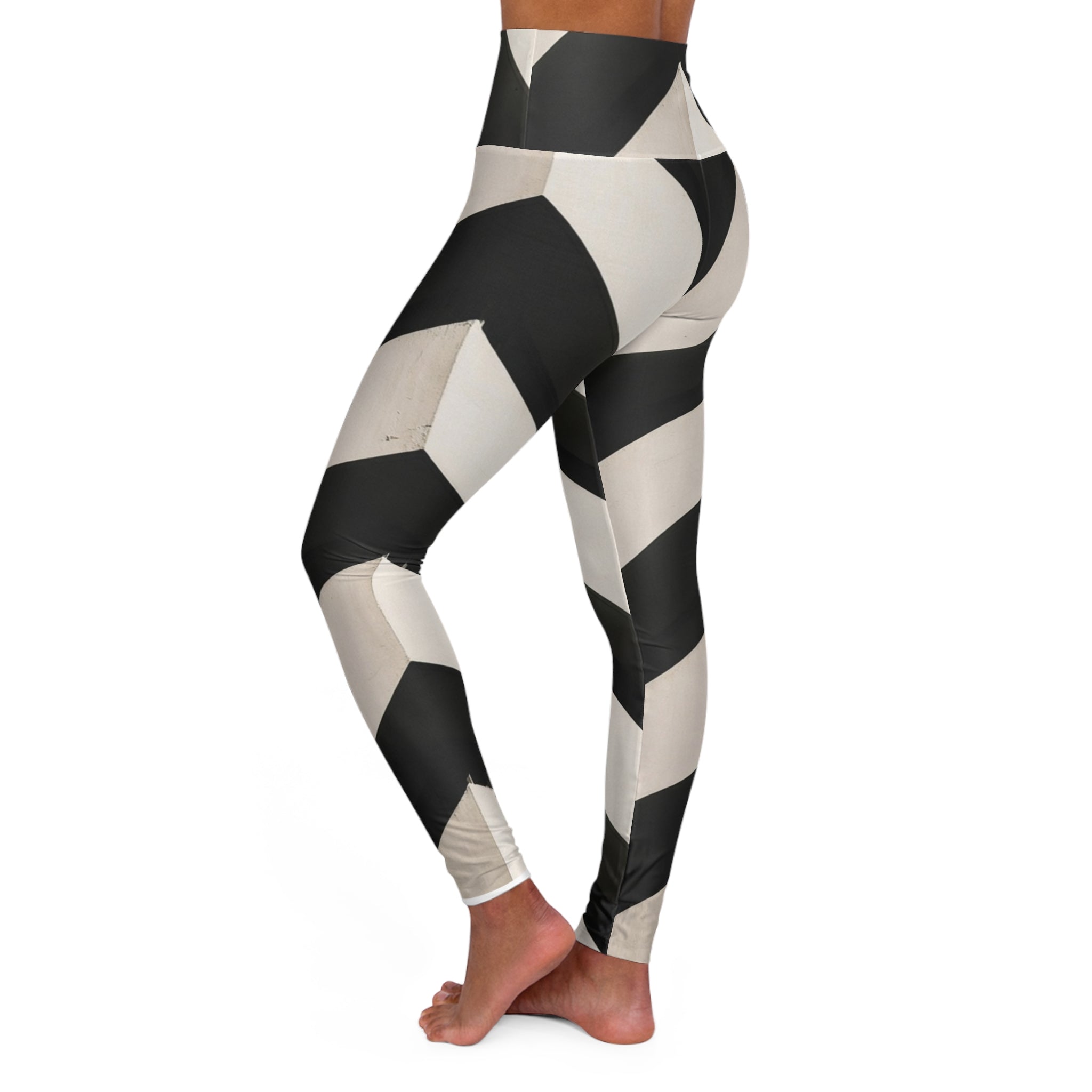 High-waisted leggings with bold black and white geometric pattern, side view