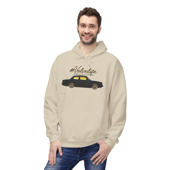 Smiling man in beige hoodie with black vintage car and '#Volvolife SWEDISH BRICK' graphic