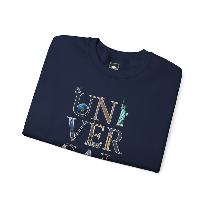 Navy blue t-shirt with UNIVERSAL text and travel icons, folded on white background.