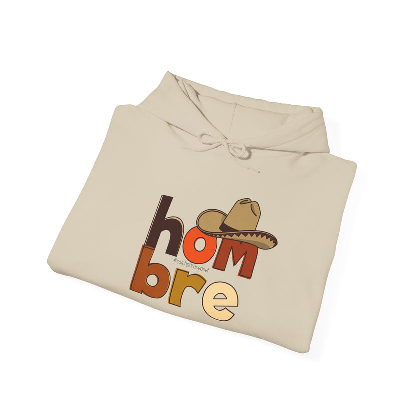 Beige hoodie folded with 'hombre' text, cowboy hat graphic, and #catchphrasepoet on front