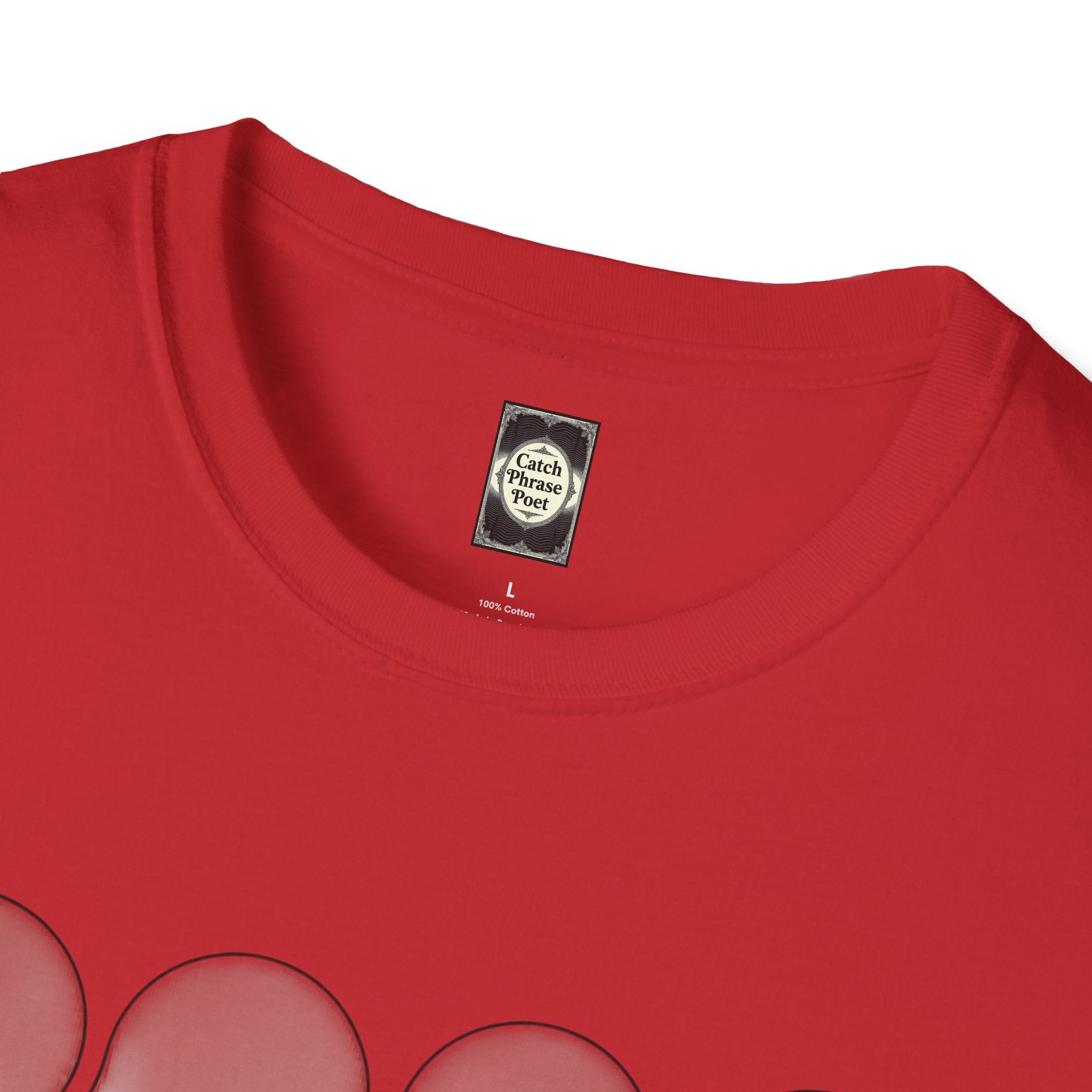 Close-up of red cotton t-shirt with rounded neckline and graphic print detail