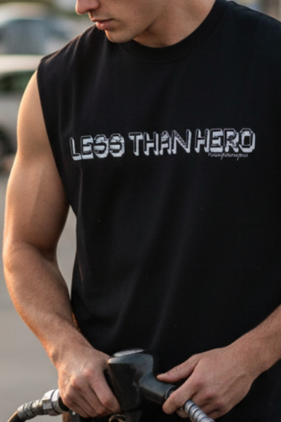 Black sleeveless shirt with 'MOTIV.' logo on a white background