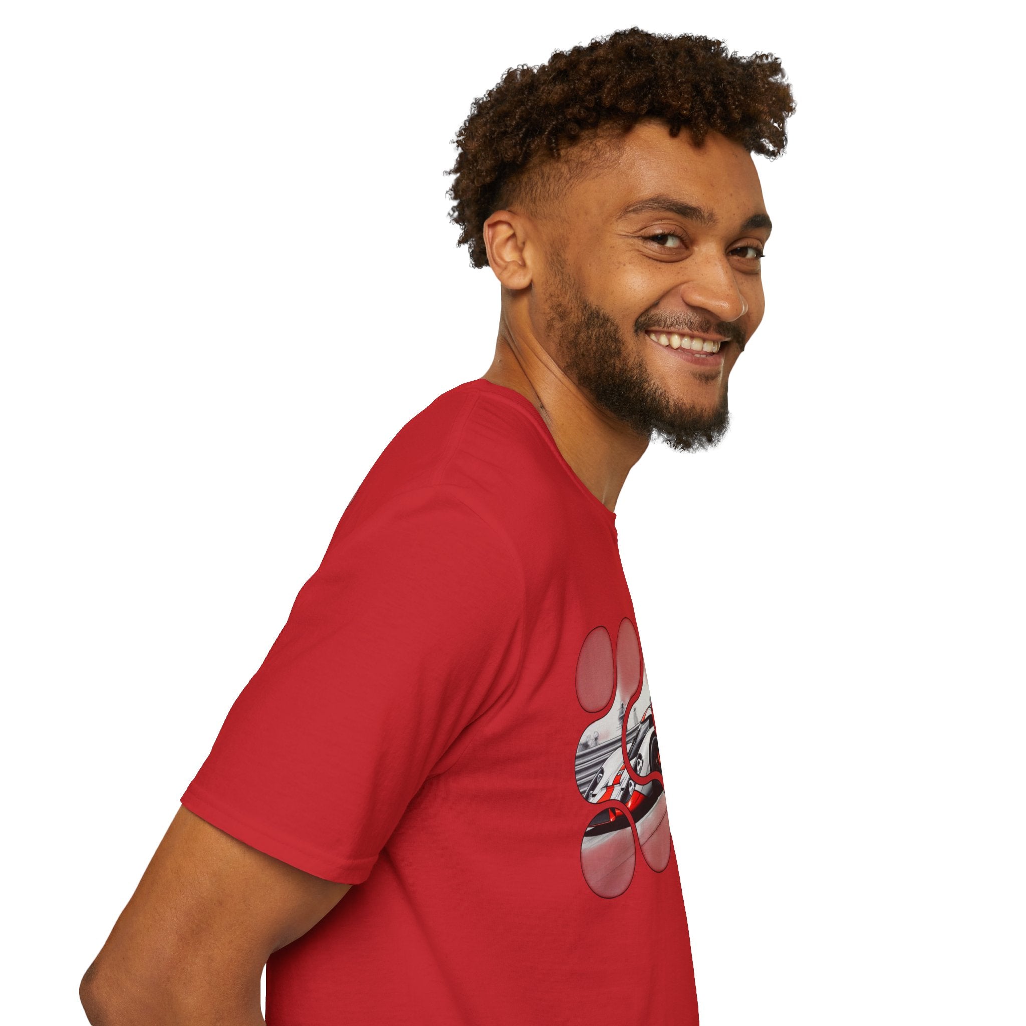 Man wearing a red graphic t-shirt with a creative circular design, smiling, side view