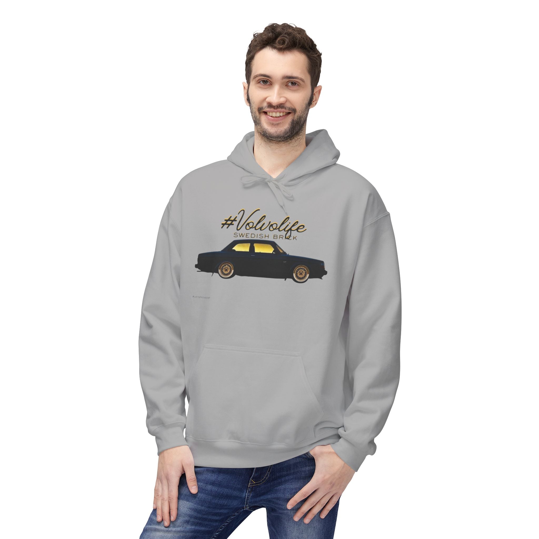 Man wearing grey hoodie with #VolvoLife Swedish Brick car graphic print