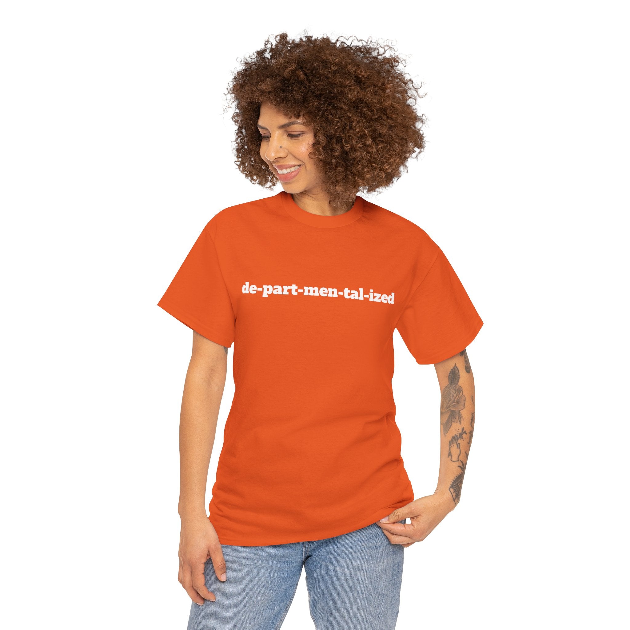 Woman in orange t-shirt with 'de-part-men-tal-ized' text, casual clothing style