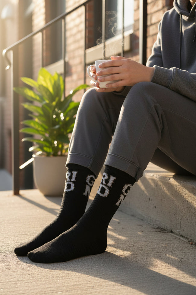 Black socks with white text on a white background