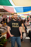Man wearing a black t-shirt with 'FREE HUGS' text on a white background