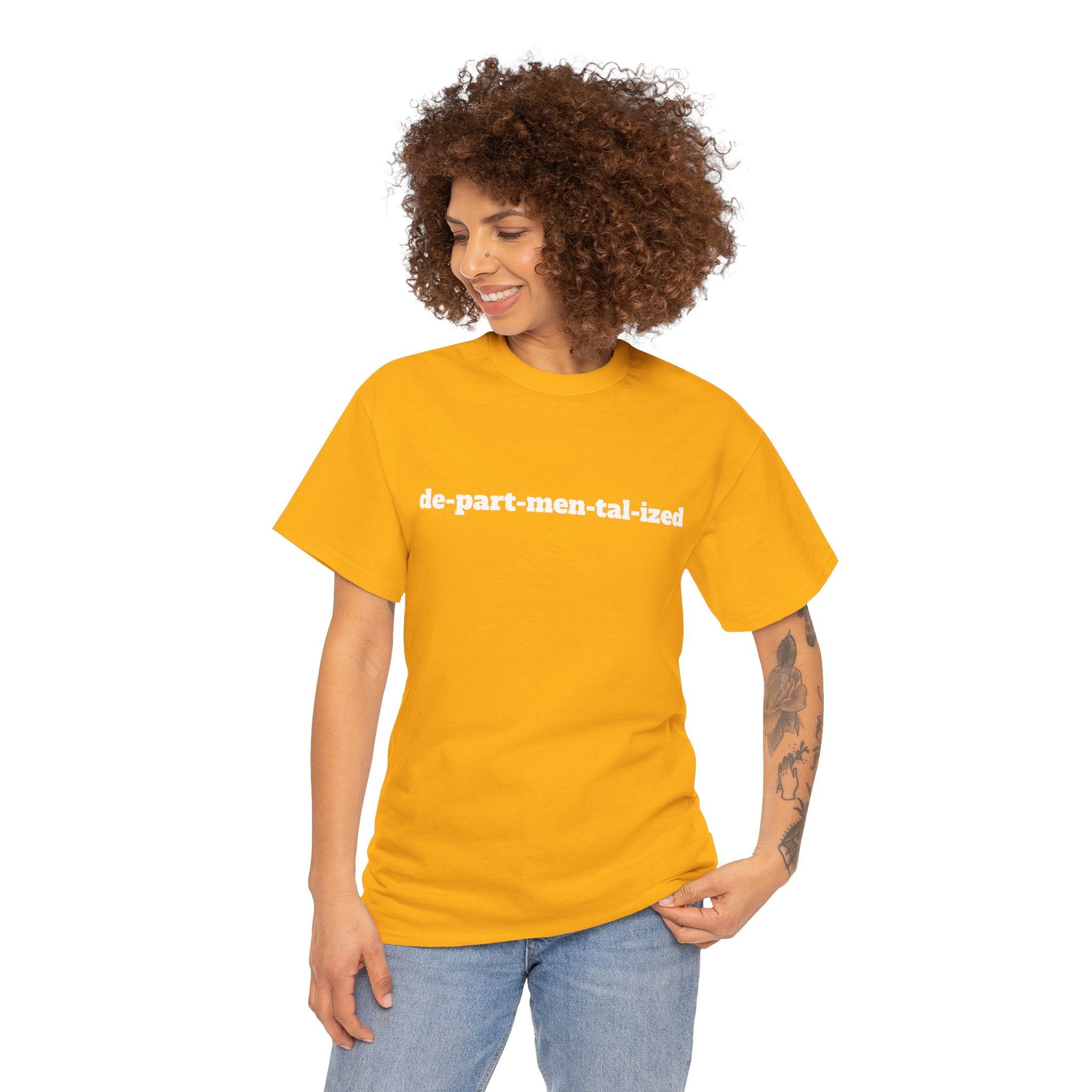 Person wearing a yellow t-shirt with 'de-part-men-tal-ized' text, casual fashion style