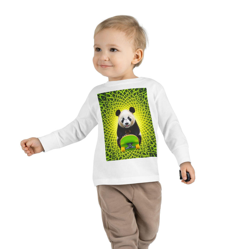 Smiling toddler in white shirt with panda and skateboard graphic, geometric yellow-green background