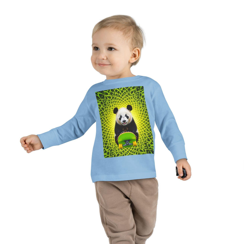 Toddler in blue sweatshirt with panda and skateboard graphic, yellow green abstract background
