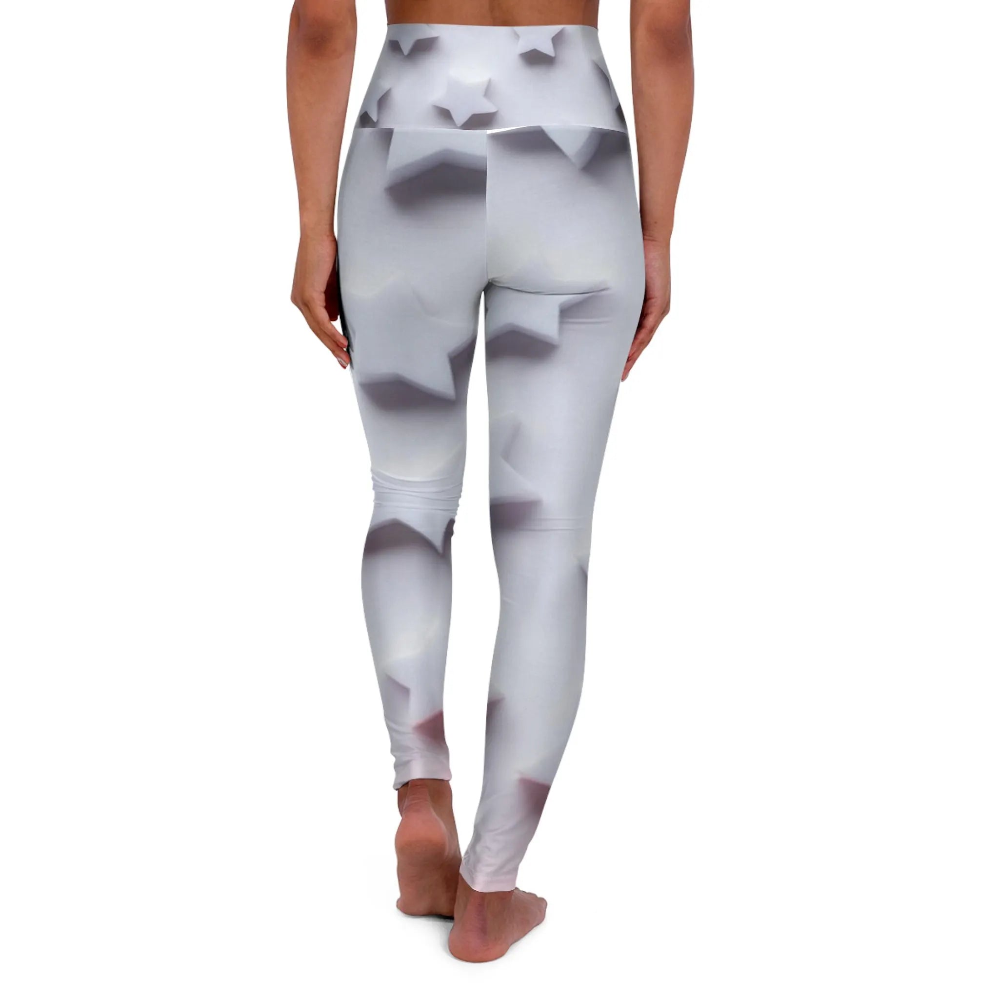 Woman wearing high-waisted white leggings with 3D star pattern, back view