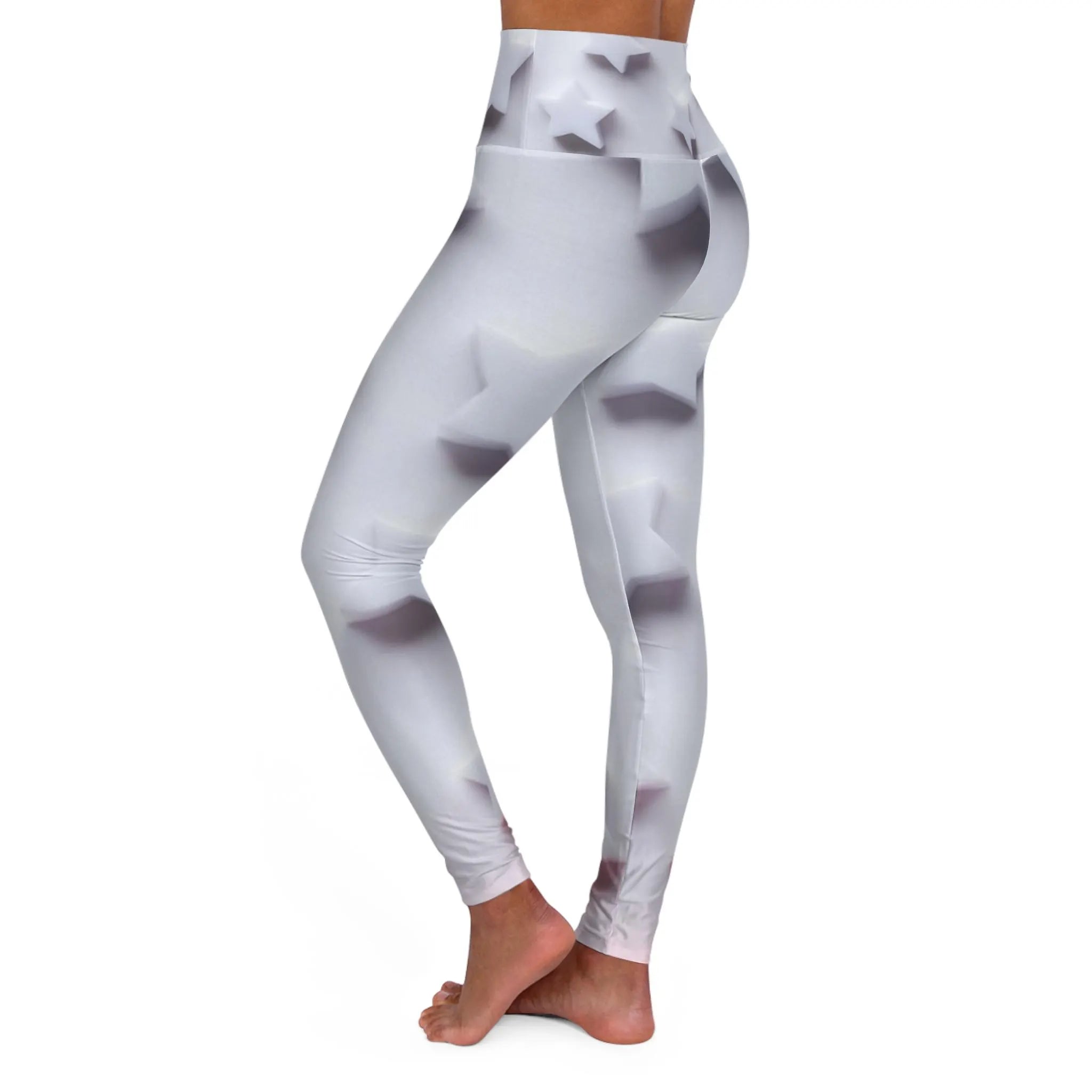 White high-waisted leggings with subtle 3D star pattern, model standing barefoot